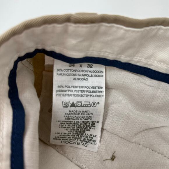 Tan dockers dress plants tag size 32x34. Measure 35” x 30.5” x 11.5” i - Picture 4 of 6